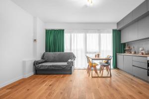 a living room with a couch and a table at XTN Chill House Aeroport with parking in Cluj-Napoca +11 photos