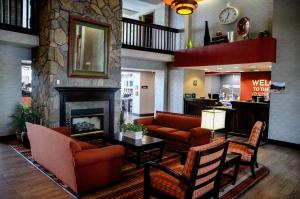 a lobby with couches and a fireplace in a hotel at Hampton Inn & Suites Flagstaff - West in Flagstaff