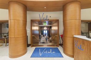 a view of a lobby with a vida sign on the door at Conrad Fort Lauderdale Beach in Fort Lauderdale +87 photos