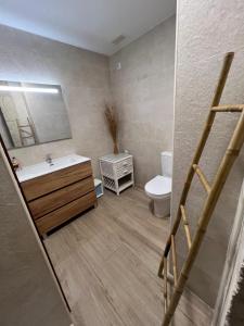 a bathroom with a sink and a toilet at Apartamentos El Dorado in Miami Platja +32 photos