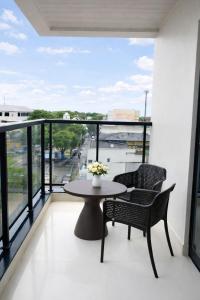 a balcony with two chairs and a table on a balcony at Miraflores Hotel in Macapá