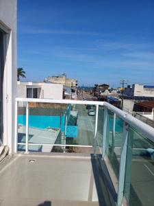 a balcony with a view of a street at Suíte praia de leste in Pontal do Paraná