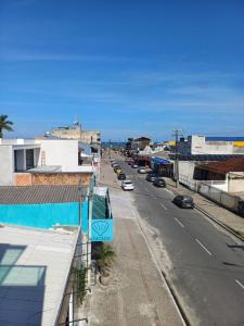 a view of a city street with cars on the road at Suíte praia de leste in Pontal do Paraná
