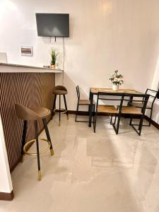 a dining room with a table and chairs at Log Cabin Tagaytay in Tagaytay