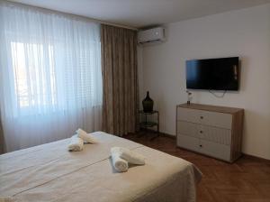 a hotel room with a bed with towels on it at Casa Mia 2 in Punat