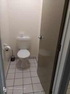 a bathroom with a white toilet in a stall at Mt Hutt Views at 23 Methven in Methven +24 photos