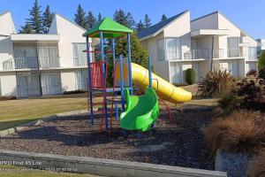 a playground in front of a apartment building at Opuke Studio Methven in Methven