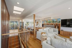 a living room with a couch and a table at Bunkers at Seven Mile in Seven Mile Beach