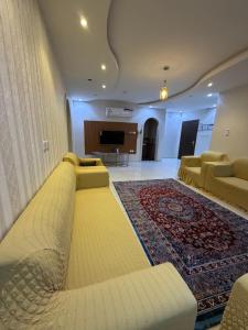 a large living room with couches and a television at شوران الأولى in Medina