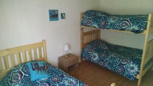 Un pat sau paturi într-o cameră la Cabañas Felipe