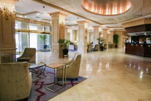 a lobby with chairs and a table in a building at Hilton Jackson in Jackson