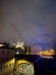 a bridge with a crane in a city at night at ANCiENT CiTY WALL in Nuremberg