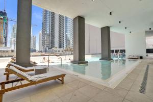 a swimming pool with a view of a building at Miami Condo 2BR Rooftop Pool & Gym in Miami
