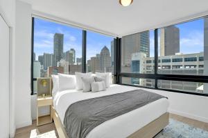 a bedroom with a large bed and a large window at Miami Condo 2BR Rooftop Pool & Gym in Miami +68 photos
