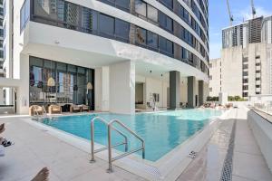 a swimming pool in the middle of a building at Miami Condo 2BR Rooftop Pool & Gym in Miami