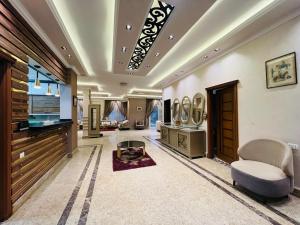 a large living room with a couch and a table at فيلا دريم in Sphinx International Airport