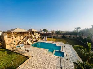 an overhead view of a swimming pool in a house at فيلا دريم in Sphinx International Airport