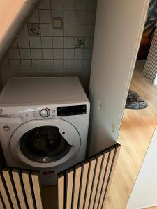 a washer and dryer in a small room at ANCiENT CiTY WALL in Nuremberg +5 photos