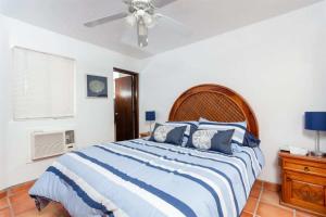 a bedroom with a bed and a ceiling fan at Beautiful Beachfront Condo Olas I 16 in Puerto Peñasco +25 photos
