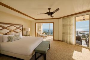 a bedroom with a bed and a view of the ocean at Grand Wailea Resort Hotel & Spa, A Waldorf Astoria Resort in Wailea +71 photos