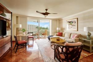 a living room with a couch and a table at Grand Wailea Resort Hotel & Spa, A Waldorf Astoria Resort in Wailea