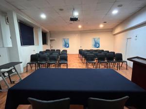 a conference room with a table and chairs in it at Blub Hotel Spa in Huancayo