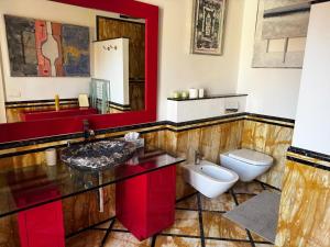 a bathroom with a sink and a toilet at Beautiful Apartment Teatro Cervantes in Málaga +19 photos