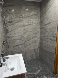 a bathroom with a sink and a shower at Za potokiem-Solina 66-77-44-4-61 in Solina +84 photos