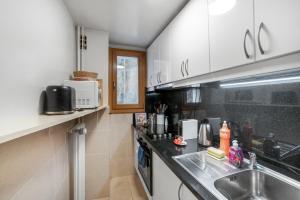a kitchen with a sink and a counter top at Boël 3 studio in Geneva +3 photos