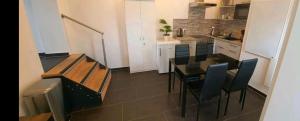 a small kitchen with a table and chairs in it at Ferienwohnung NR2 in Großräschen