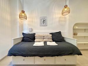 a bedroom with a large bed with two pillows at Casa Sauge in Grasse