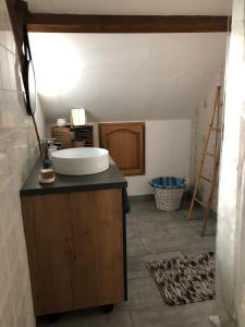 a bathroom with a sink on a counter at Locéane in Le Pêchereau +10 photos