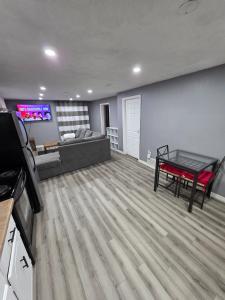 a living room with a couch and a table at Bright Cozy 2-Bedroom Main Floor Suite in Brampton
