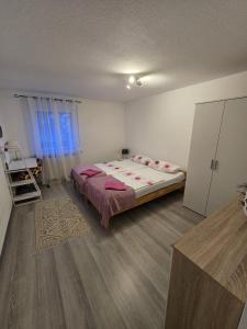 a bedroom with a bed in a room at Bartol in Immendingen
