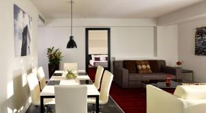 a living room with a table and a couch at Park Plaza Leeds in Leeds +68 photos