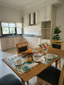 a kitchen with a wooden table with food on it at Departamento en Reconquista in Reconquista
