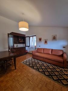 a living room with a couch and a table at Casa Vanda in San Lorenzo