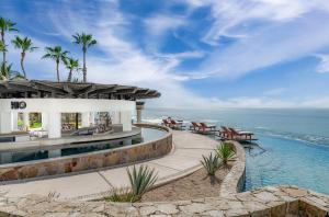an exterior view of a resort with the ocean at Hilton Los Cabos in San José del Cabo