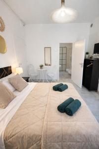 a bedroom with a large bed with two pillows on it at LA CASA DI GIADA - uscita autostrada di Imola - self check in - parcheggio privato in Imola