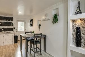 a kitchen and dining room with a table and chairs at Oasis Hideaway Apt w/ Rainforest Shower! in Baltimore