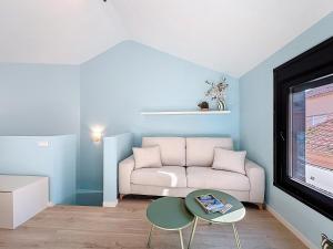 a living room with a couch and a table at Casa PedraParda in O Grove