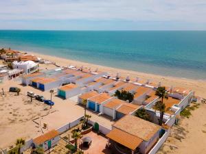 an aerial view of a beach with buildings and the ocean at Comfortable Beachfront Condo Las Olas II 1 in Puerto Peñasco