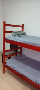 a pair of bunk beds in a room at Casa com Quarto Duplo com Banheiro Privativo in Rio de Janeiro