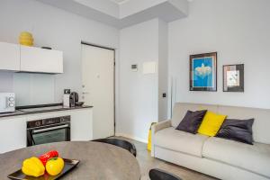 a living room with a couch and a table at Suite Andrea-Luxury Central Suite in Bergamo