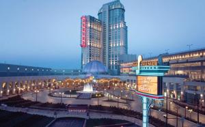 a city with tall buildings and a fountain in a courtyard at Hilton Niagara Falls/ Fallsview Hotel and Suites in Niagara Falls