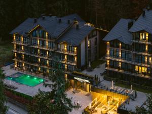 an aerial view of a hotel at night at Wood Hotel Resort & SPA in Bukovel