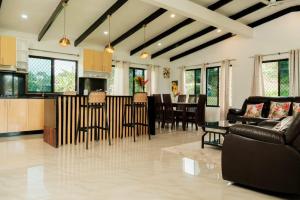 a living room with a kitchen and a dining room at Raluve BnB in Rakiraki