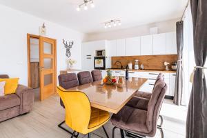 a kitchen and dining room with a table and chairs at Apartment Petar in Kaštela