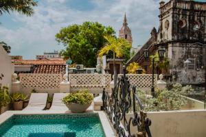 a view from the balcony of a house with a swimming pool at Estrella de San Pedro by Zakher in Cartagena de Indias