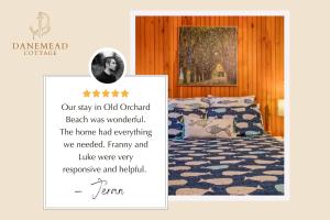 a picture of a bedroom with a bed and a poster at Danemead Cottage - For 10ppl in Old Orchard Beach
